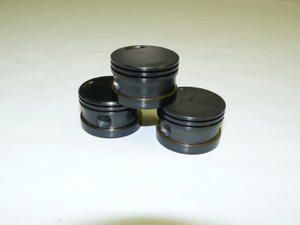 Pistons céramisés et traités au carbone diamantin. Pistons traités au carbone
