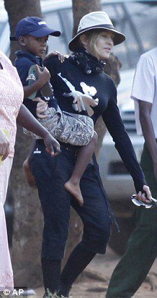 Madonna is seen carrying her adopted son David Banda 