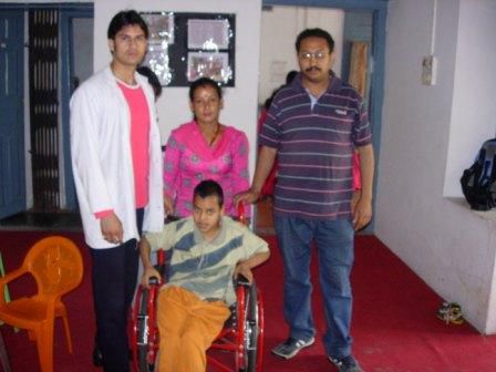 Prakash Thapa with wheel chair donated by SSA during the ca