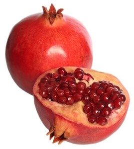 Pomegranate fruit and a half, isolated on white background