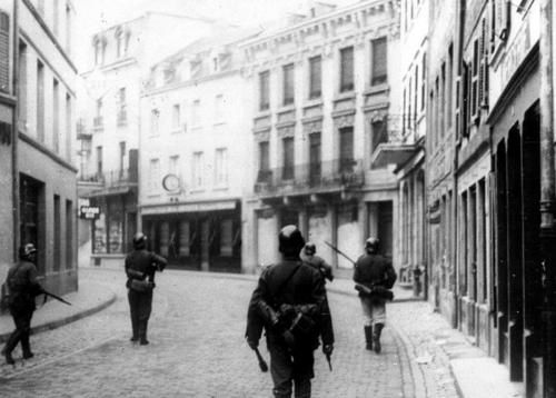 German-troops-walk-down-a-deserted-street-in-Luxembourg--on.jpg