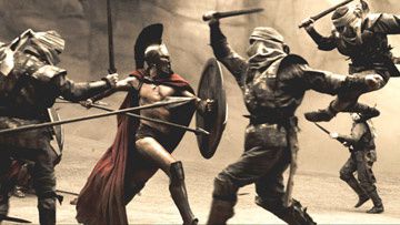 Leonidas ( Gerard Butler ) fights his way through the first wave of Persian infantry in Warner Bros. Pictures' 300