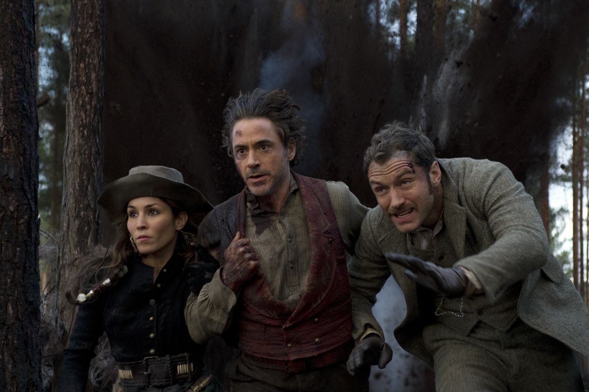 Noomi Rapace, Robert Downey Jr. & Jude Law. Warner Bros. France