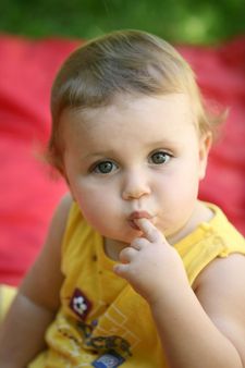 Cute happy one year old baby looking up