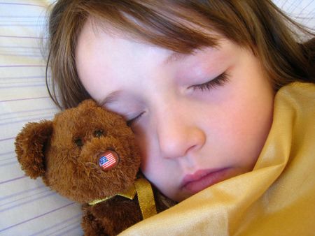 girl sleeping with teddys