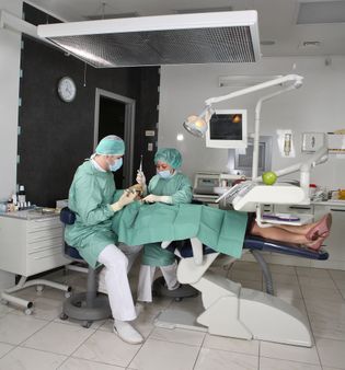 Dentist at work in dental room