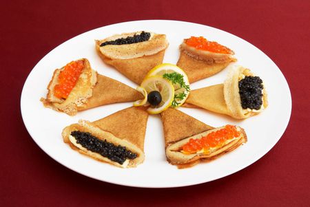Pancakes with red and black roe