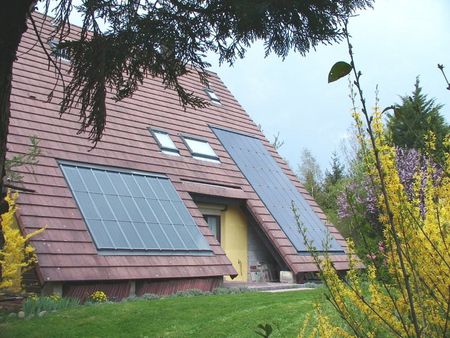 Intégration en toiture de panneaux solaires thermiques (10 m²) et ph