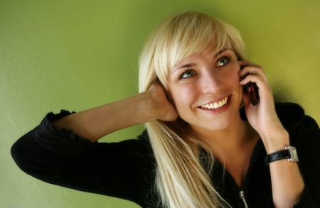 Pretty smiling blonde with the phone