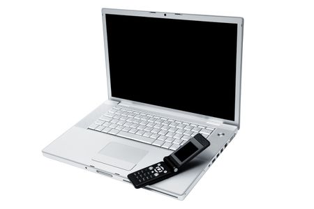 Mobile phone on the keyboard of a laptop