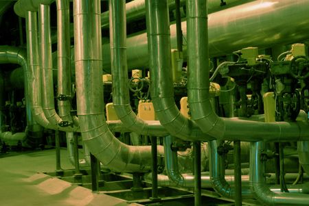 Equipment, cables and piping as found inside of a modern industr