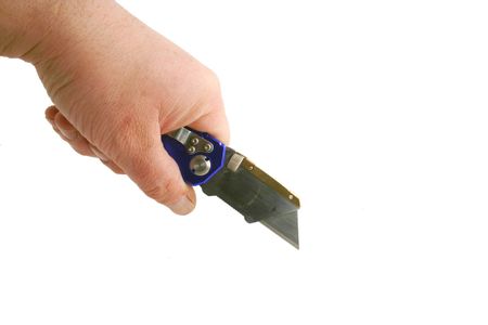 Hand using a Blue anodized contractors razor knife