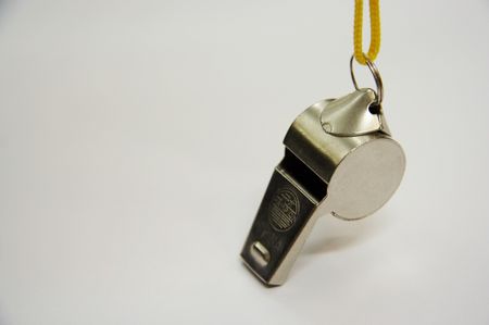 Metal whistle with the yellow cord