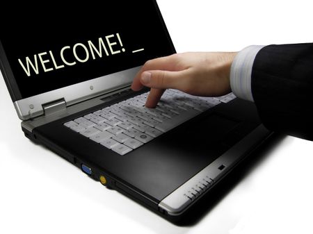 Typing Welcome on the laptop