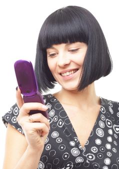 smiling woman with mobile phone close up