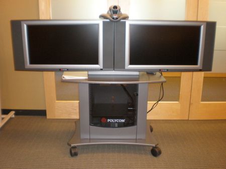 A Polycom VSX 7000 camera used for videoconferencing (top) with 2 vide