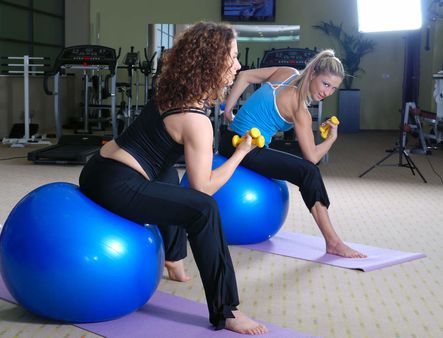 beautiful young girls working out in a gym