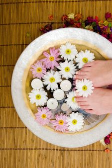 Daisies, candles and pedicured feet