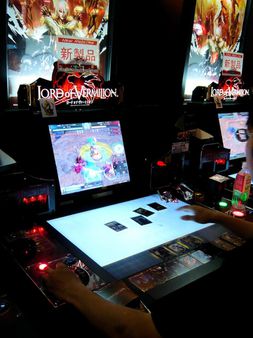 1 A gamer plays Lord of Vermilion video game on arcade. (Shibuya - Tok