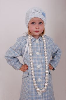 Pretty little girl in nice clothe and beads