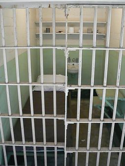Prison cell with bed inside Alcatraz main building san francisco calif