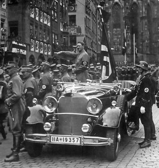 Parade of SA troops past Hitler. Nuremberg | Source Charles Russell C