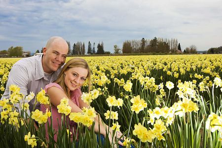 Couple in yellow flower field