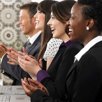 Group of four business people working in an office