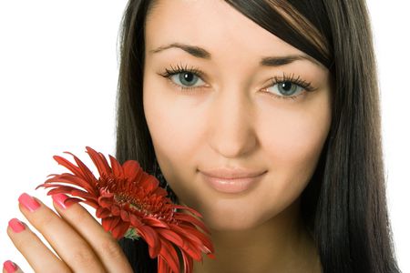 Young pretty woman holding red gerbera flower
