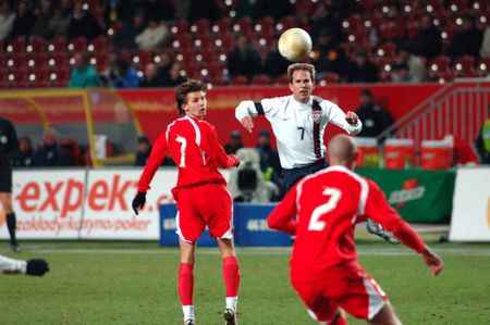 American soccer player Eddie Lewis directs the ball forward with a P