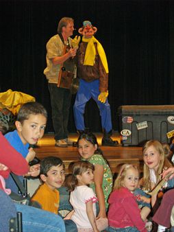 Ventriloquist Wayne Francis calls attention to the photographer as he 