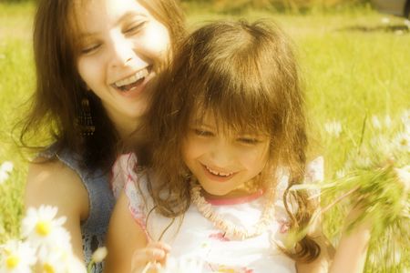 Mother resting outdoor with daughter