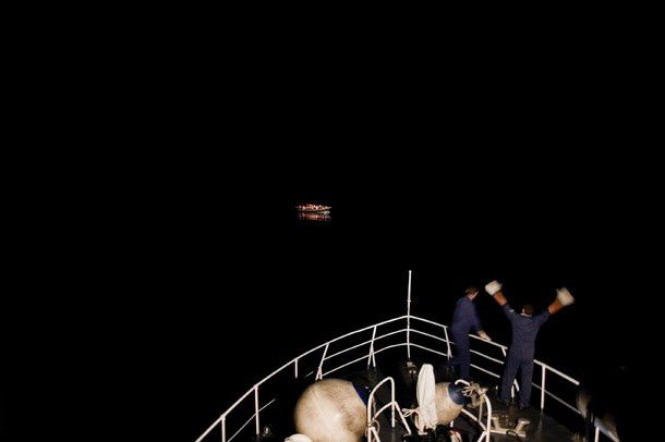Mashid Mohadjerin, Belgium, Reporters/Redux Pictures. Coastguards spot a boat with refugees, off Lampedusa, Italy, 30 July