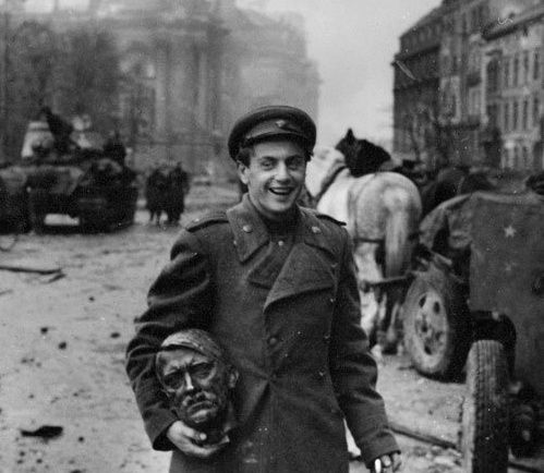 eSoviet-soldier-carrying-the-head-of-a-statue-of-Hitler--B.jpeg