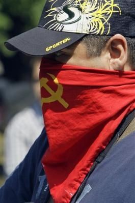 2233508881-a-demonstrator-wears-a-mask-during-a-free-the-st
